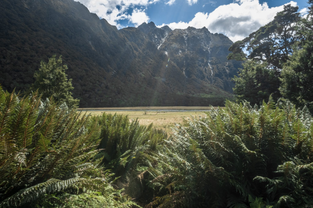 Sun peeking over the mountains at the start of the Routeburn Trek