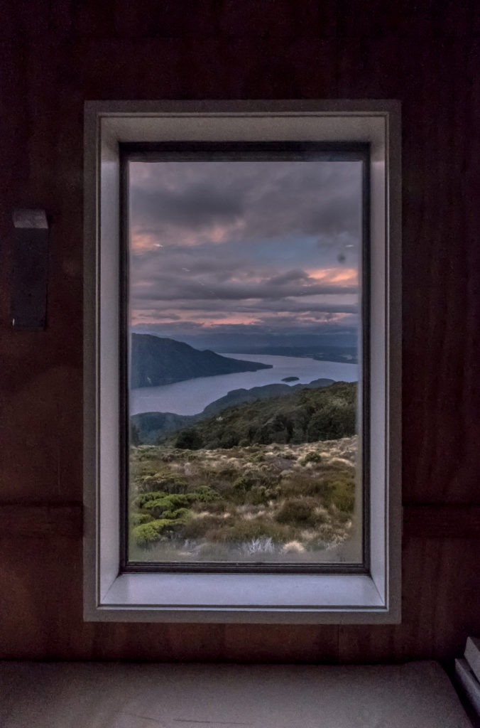 The view from inside the Luxmore Hut at sunset.