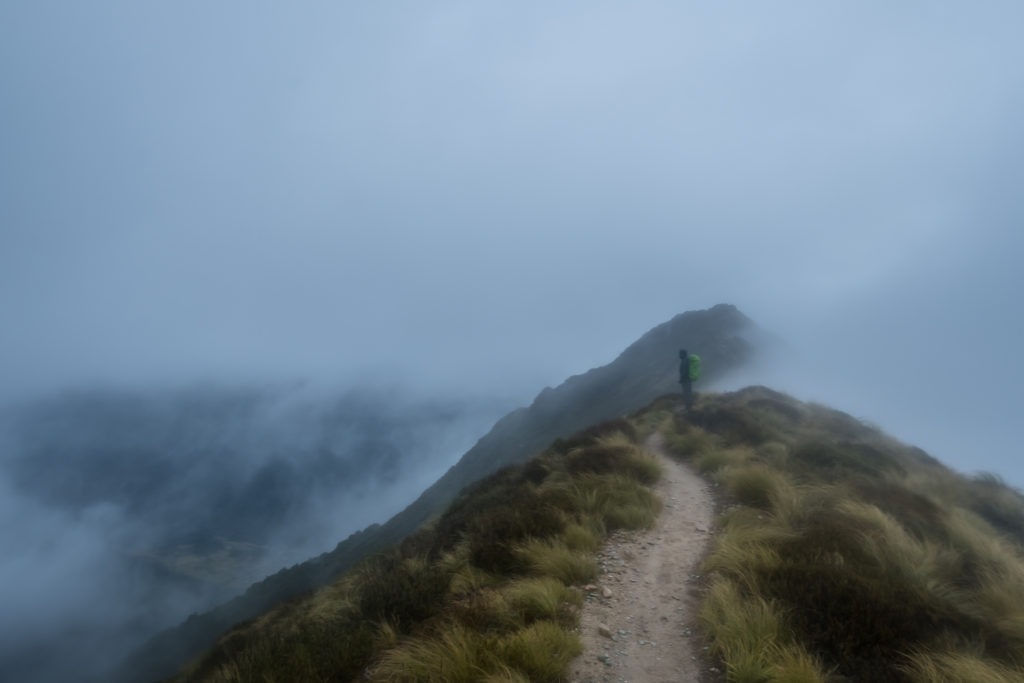 Dennis standing in the fog on the Kepler Track.